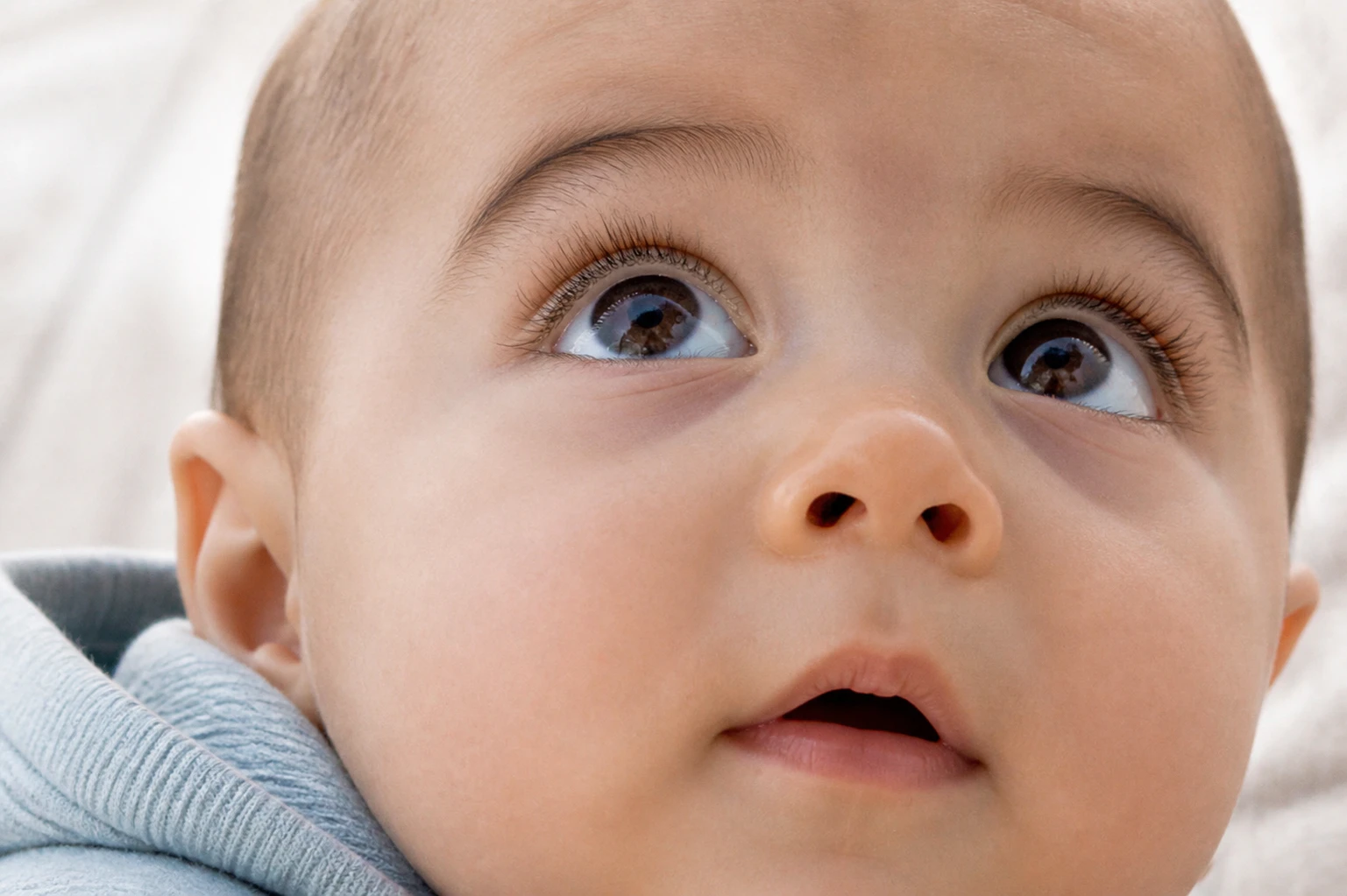 Closeup shot of a little babys eyes looking up