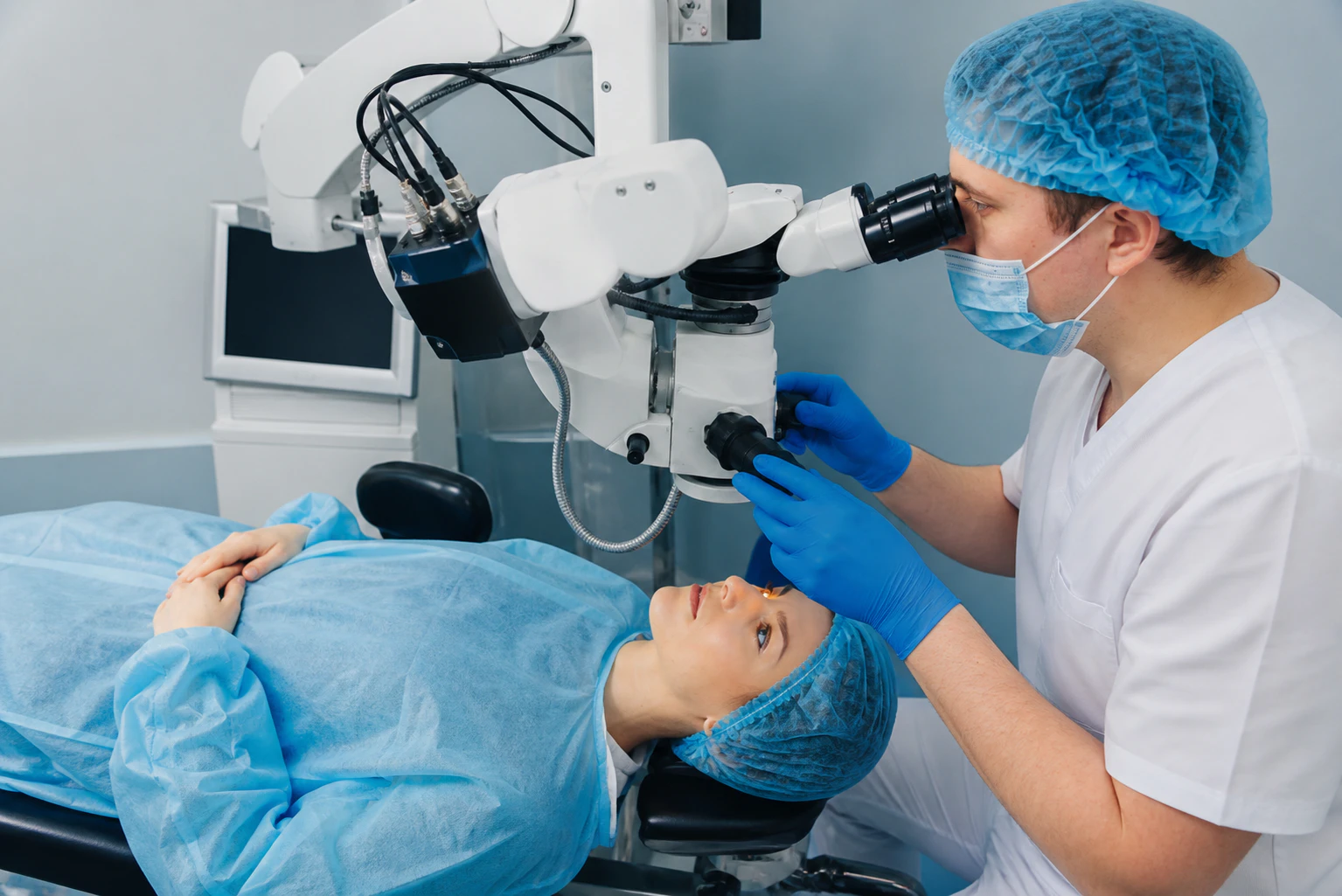 Patient under surgical microscope for vision correction