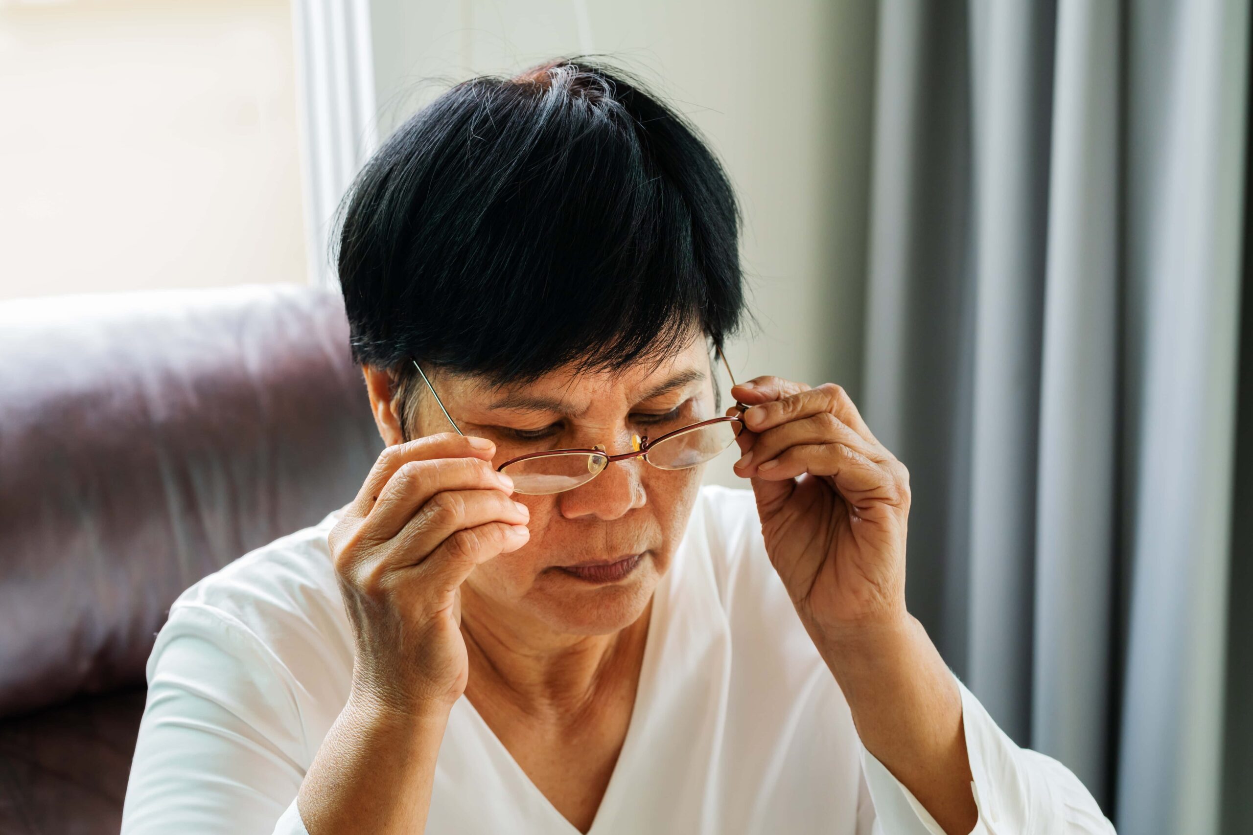 Reading Glasses 9 mature asian woman wearing her eyeglasses edited scaled