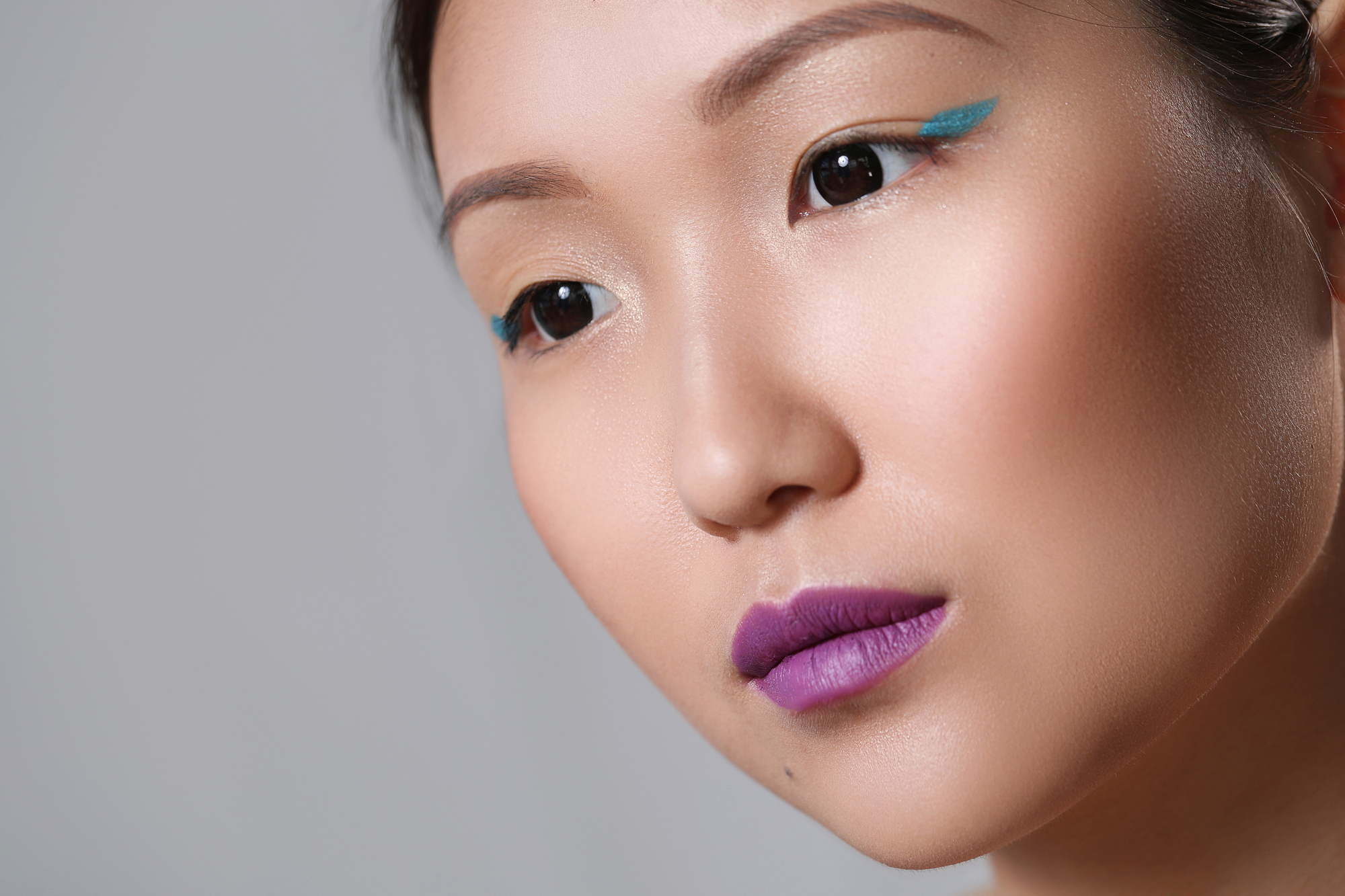Lovely asian woman with black eyes pictured in the studio